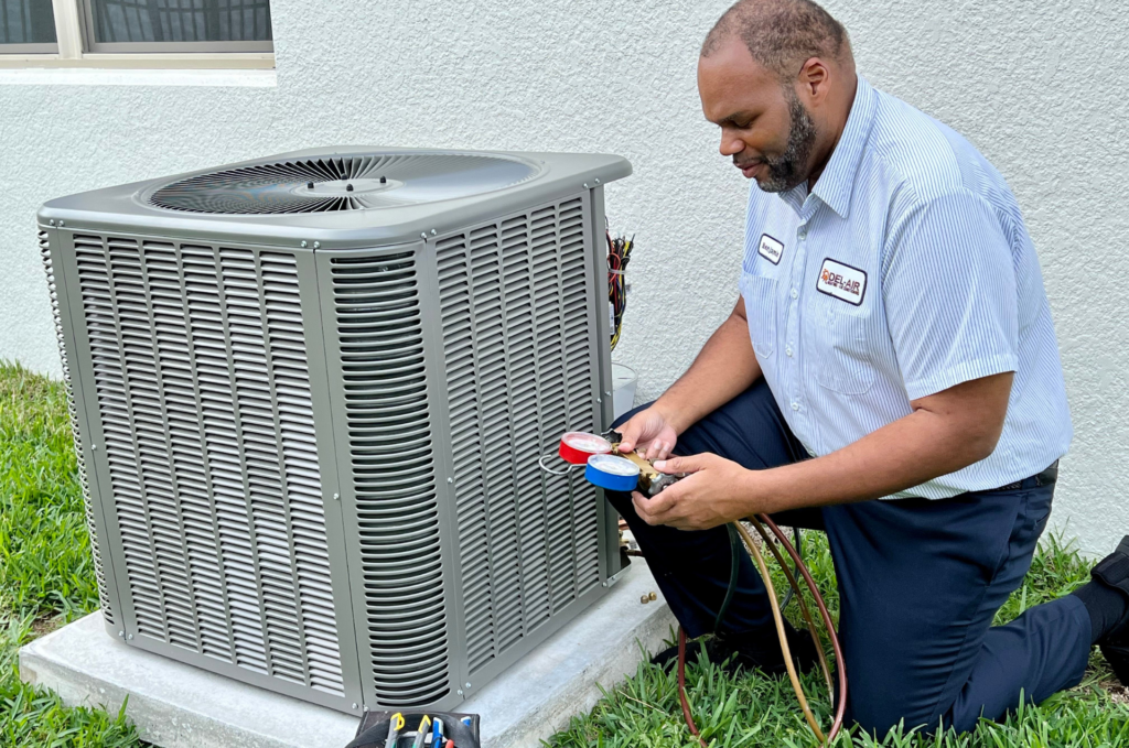A technician assessing an outdoor HVAC unit