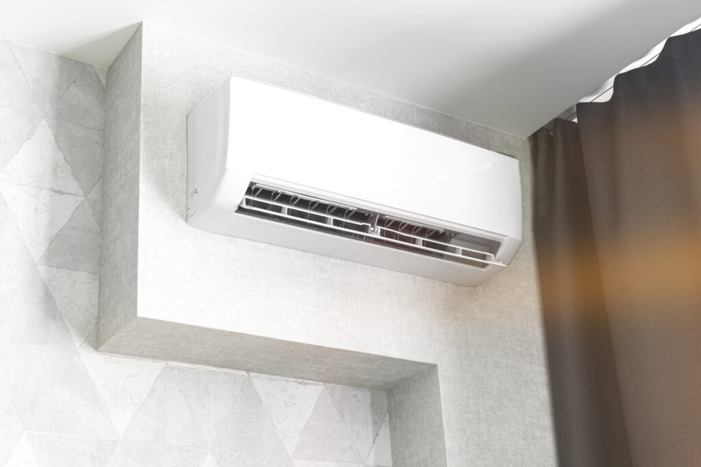 Air conditioner system on white wall in living room