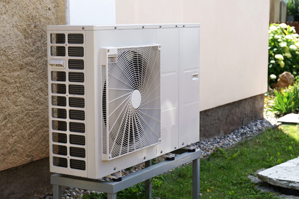 Heat pump outdoor unit outside a home