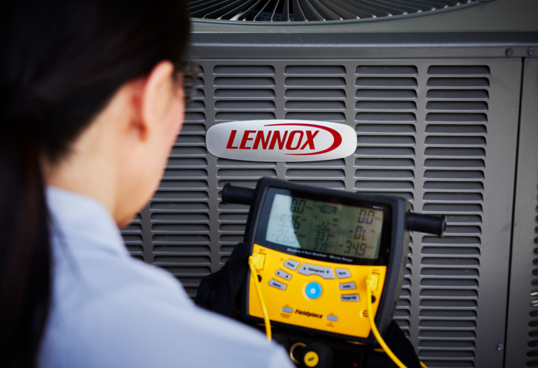 Technician testing a Lennox HVAC unit