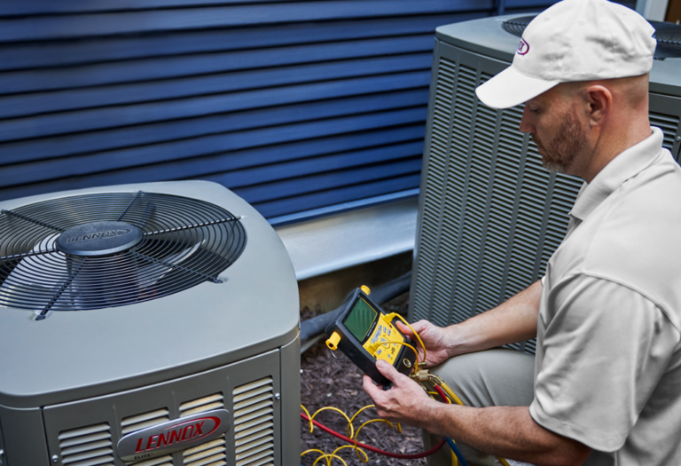 Technician assessing an AC system