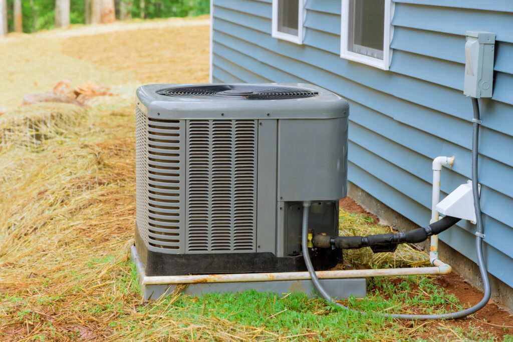 A new electric air conditioner outside a home