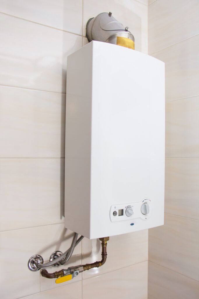 a tankless water heater on a wall