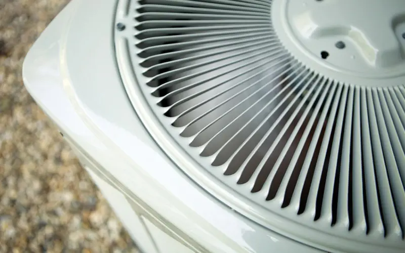 Image of an outdoor air conditioner, close up.