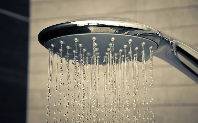 shower head with water coming out of it