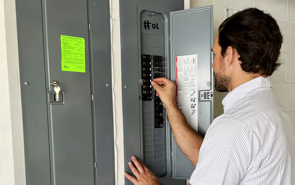 tech working on electrical switches