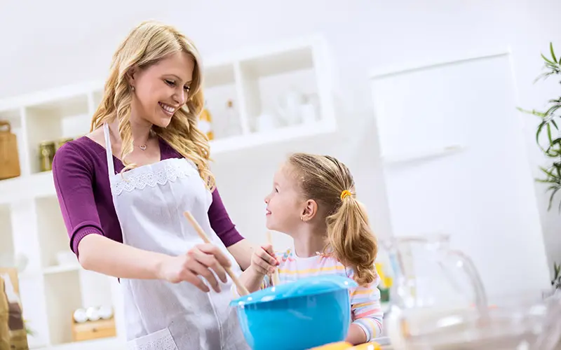 mother and child cooking in kitchen
