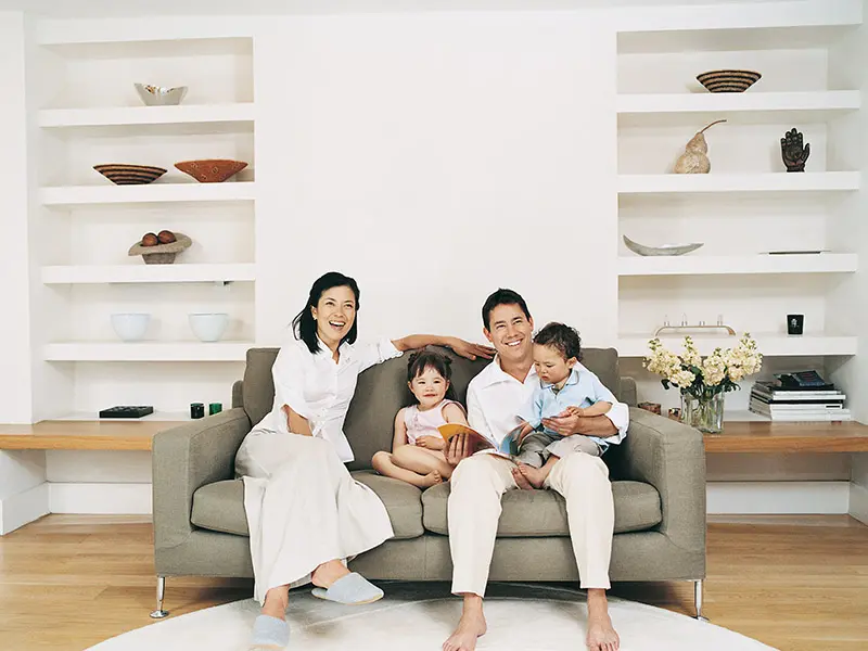 happy family sitting on couch